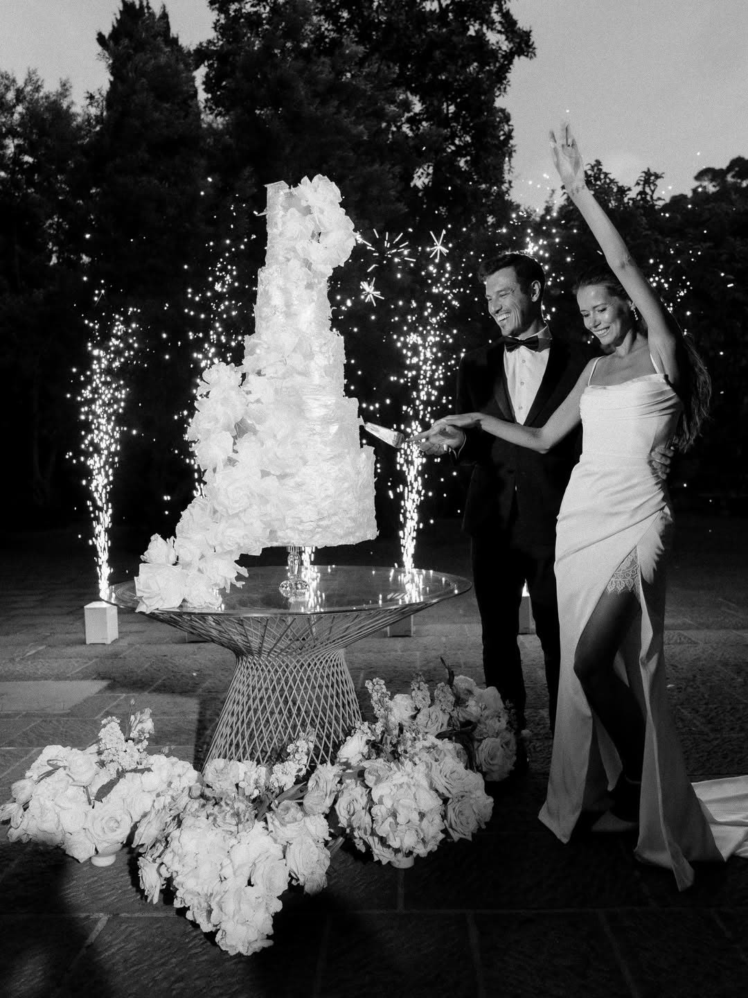 Cutting the cake beneath a shower of sparklers