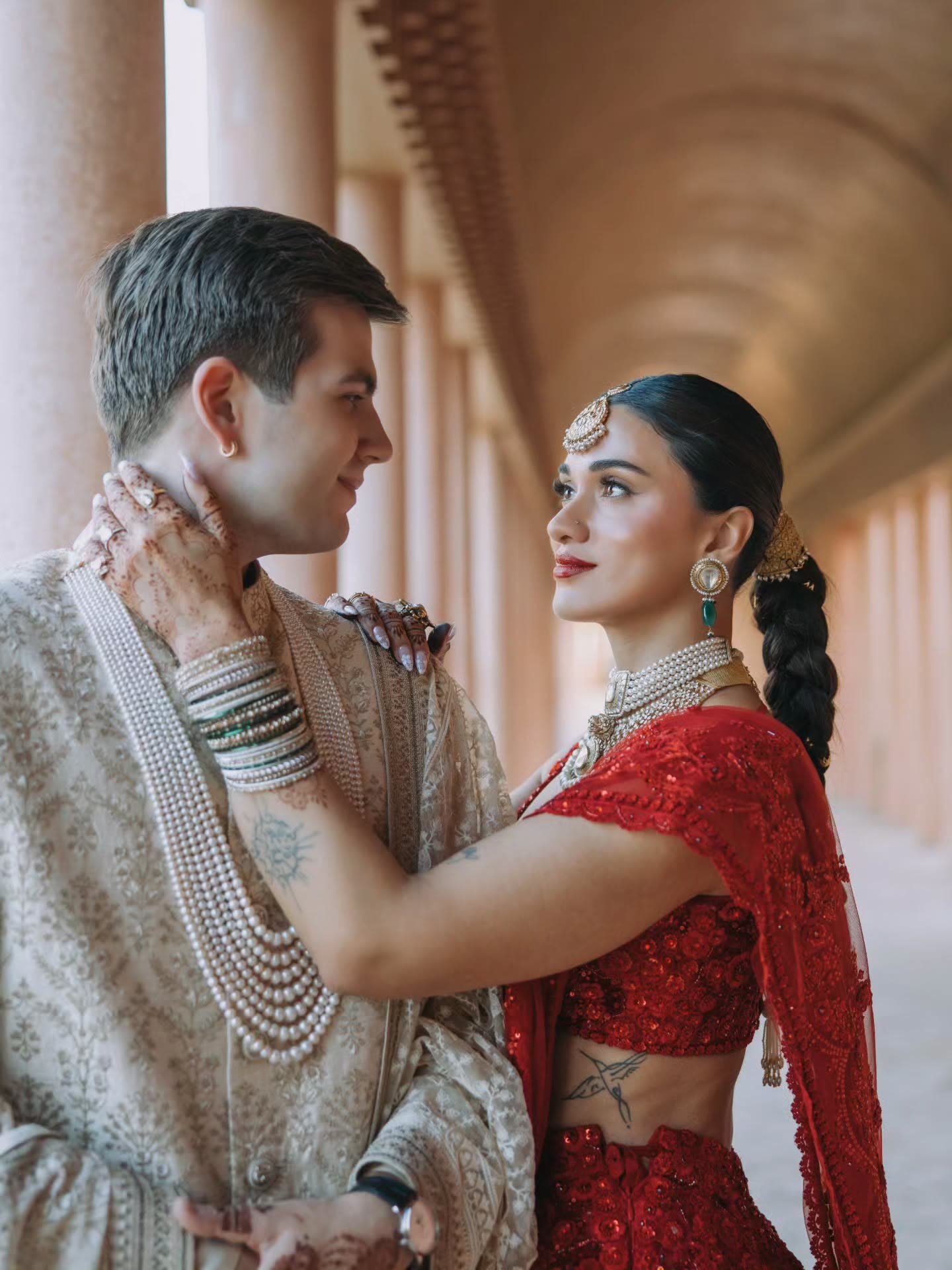 Henna and Ben beneath the arcades at their Marrakech wedding