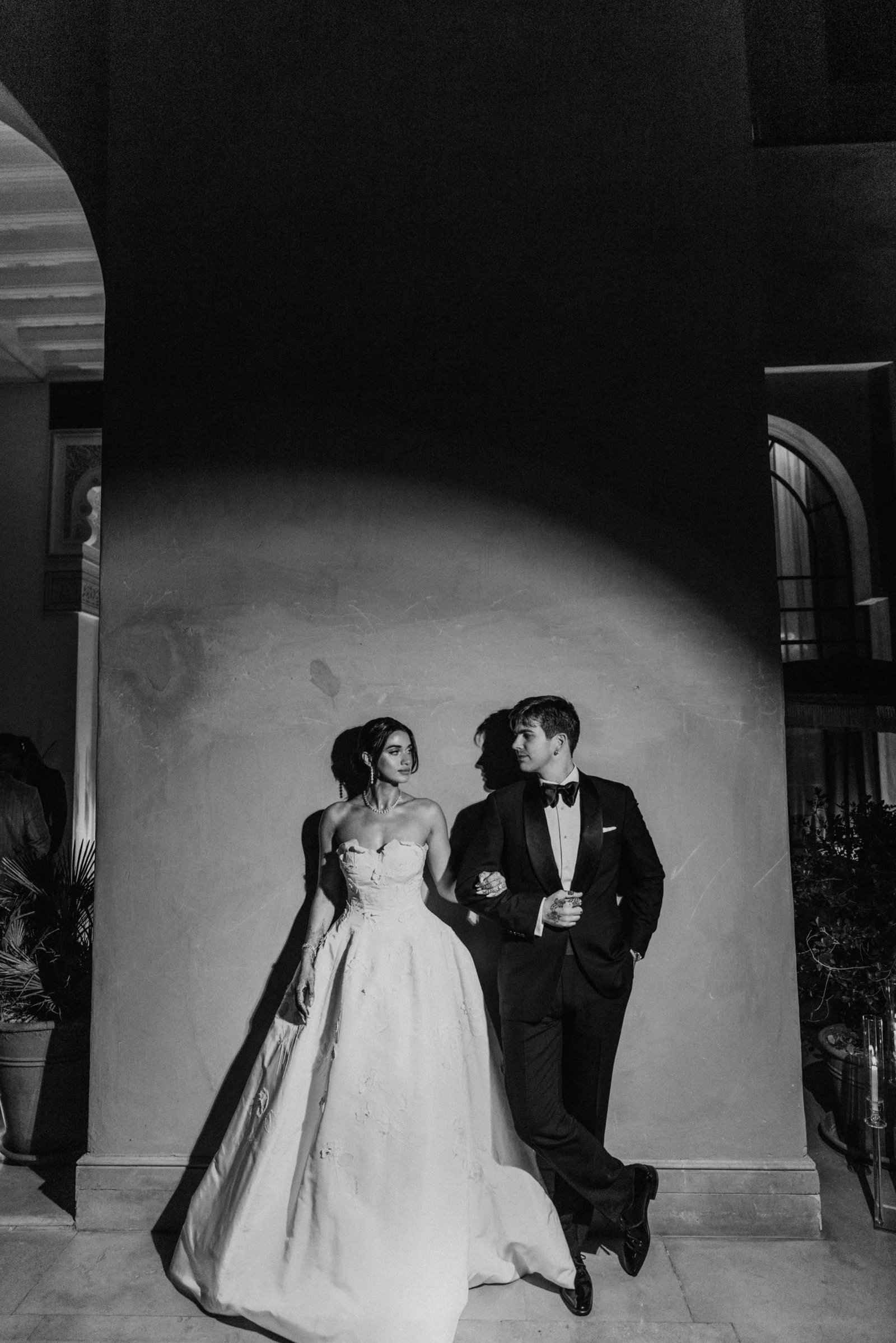 Black and white portrait of Henna and Ben in a Marrakech palace corridor