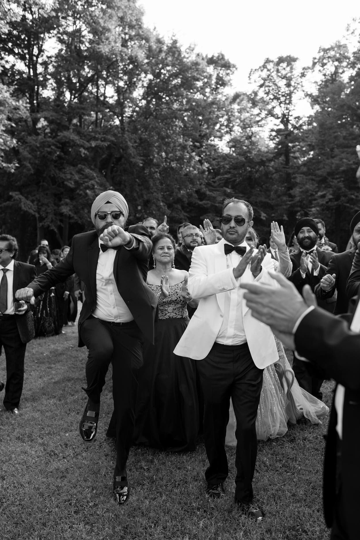 Guests dancing on the lawn at Nida and Sunny's Villa Erba wedding